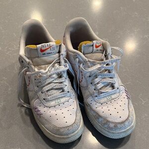 Nike Air Force 1 White and Purple Athletic Shoes stitched design